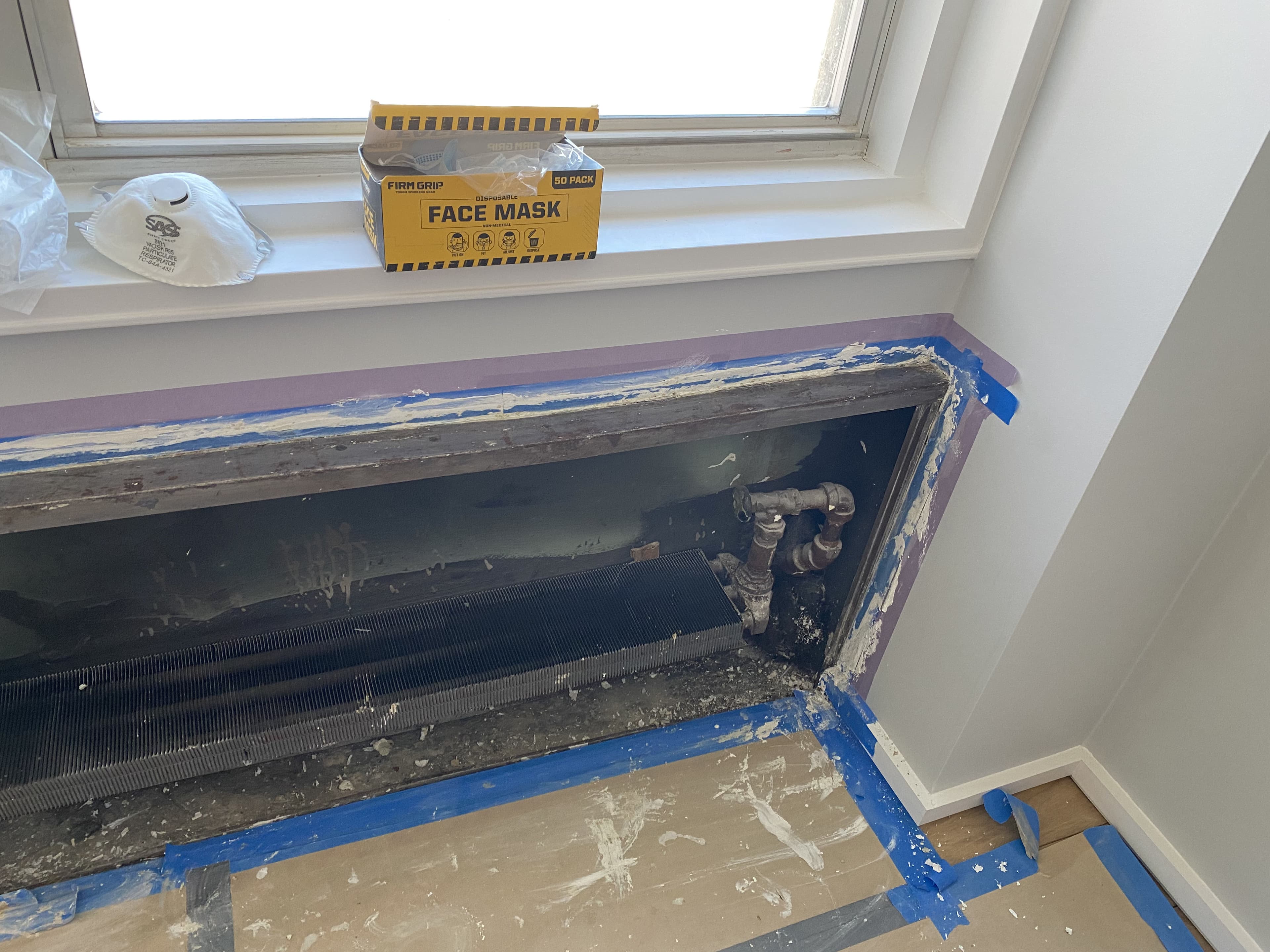 Drywall installation and wall patching in renovated bedroom