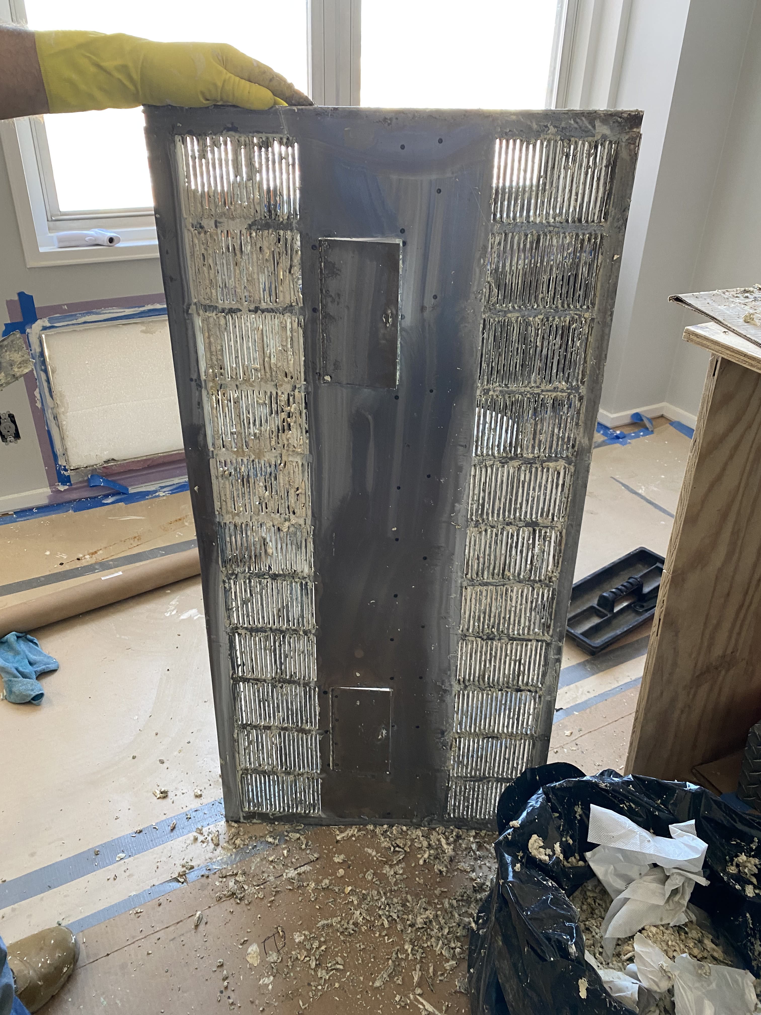 Window wall finishing with radiator access panel during renovation