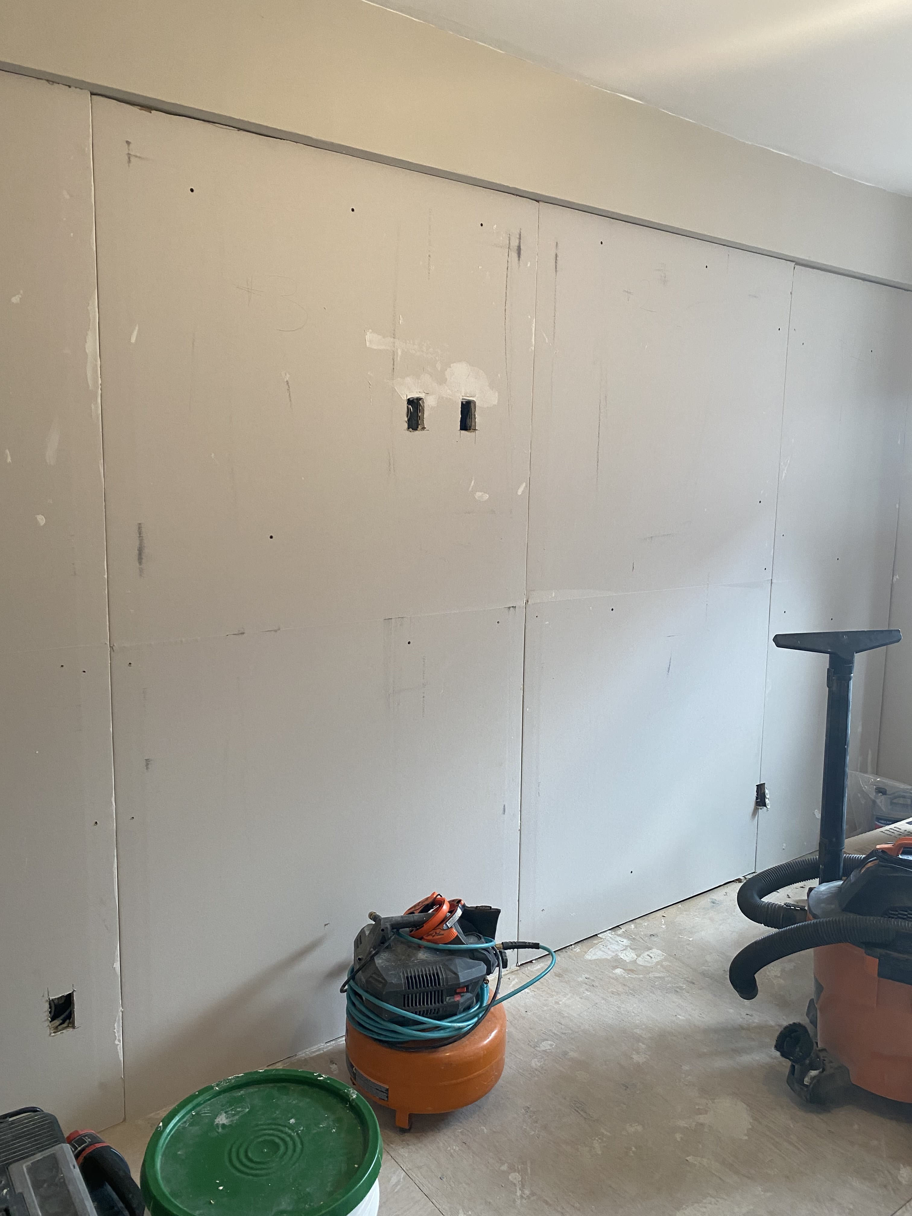 Room renovation with new wall finish and baseboard installation