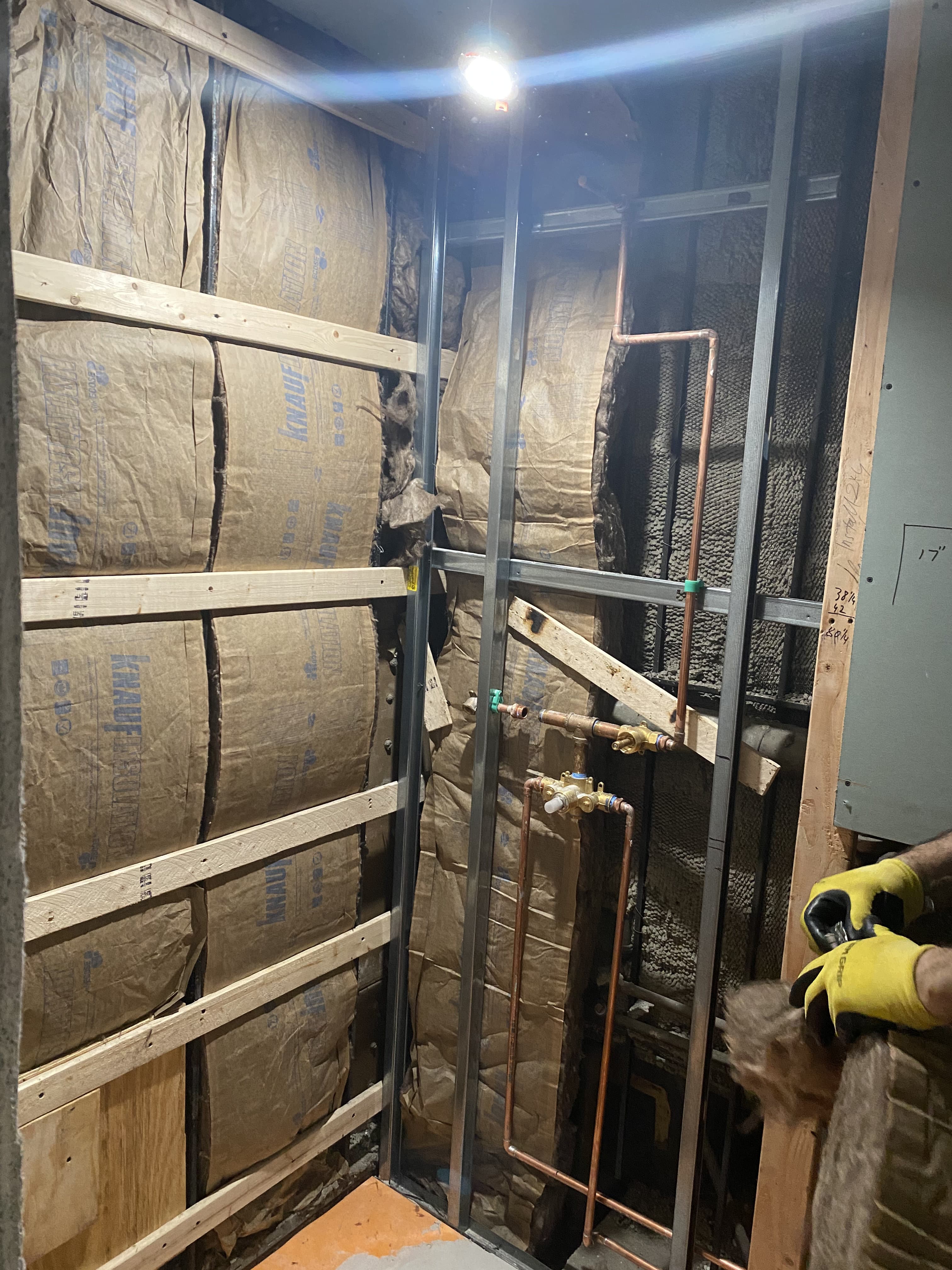 Hallway renovation with new plaster walls and floor covering protection