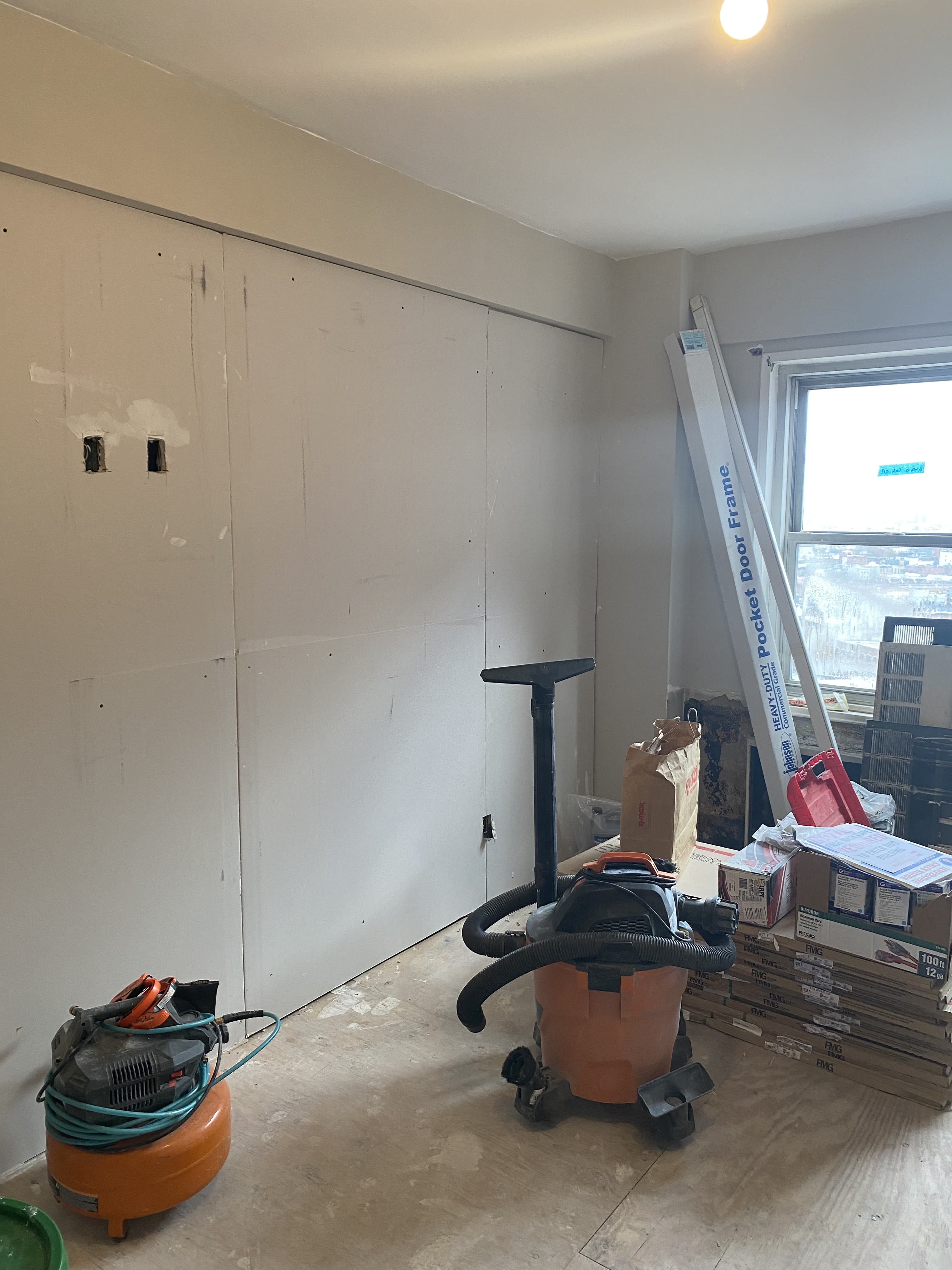 Apartment remodel featuring fresh paint and wall preparation work