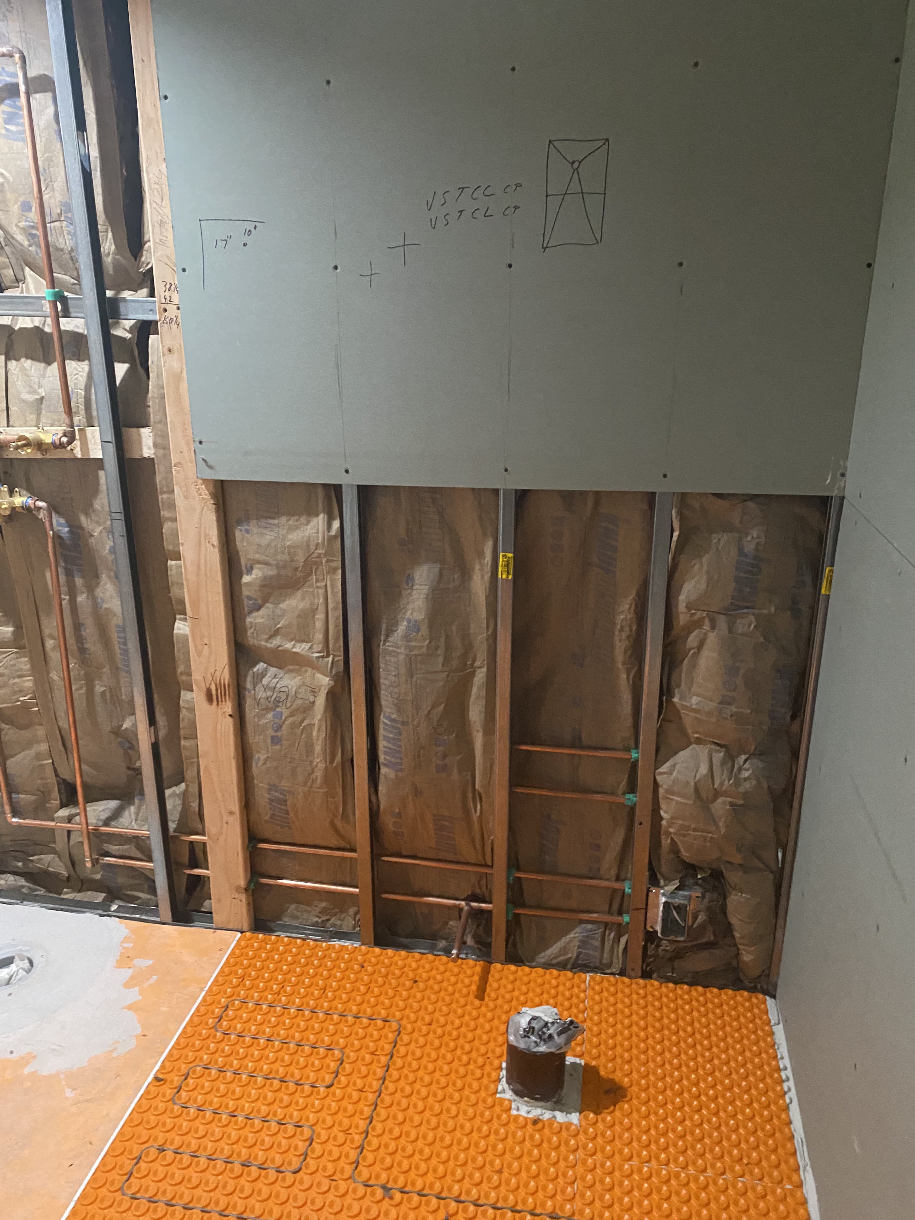 Room renovation in progress with wall patching and painting